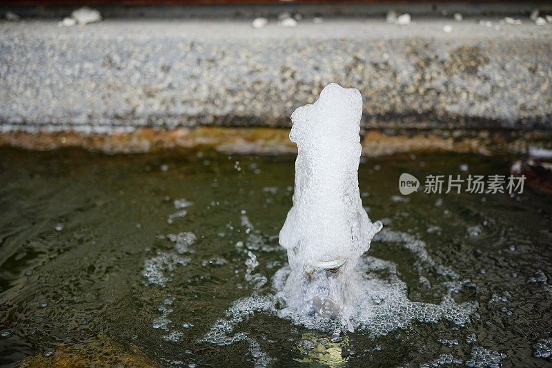 Water fountain running from tube